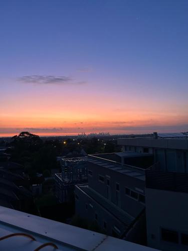 a view of the sunset from a building at Penthouse with Stunning Melbourne Skyline View in Bulleen
