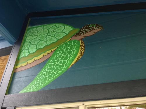 a painting of a snake on the ceiling of a house at Honu Hale in Volcano