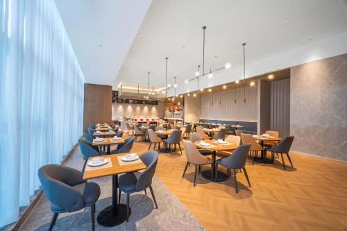 Εστιατόριο ή άλλο μέρος για φαγητό στο Kyriad Hotel Kunming Xishan Wanda Plaza Railway Station