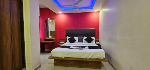 En eller flere senge i et værelse på Hotel Hill View