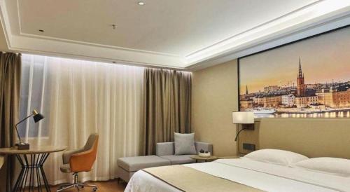Ένα ή περισσότερα κρεβάτια σε δωμάτιο στο GreenTree Inn Qingyuan Qinghe Avenue Branch