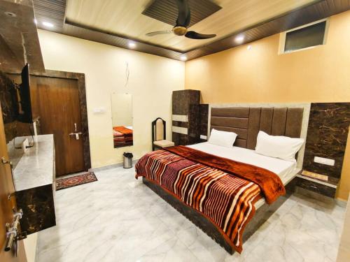 a bedroom with a bed in a room at Virat Home in Gwalior