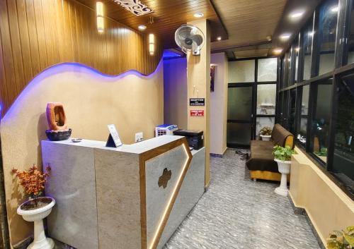 an office with a desk with a toilet in it at Virat Home in Gwalior