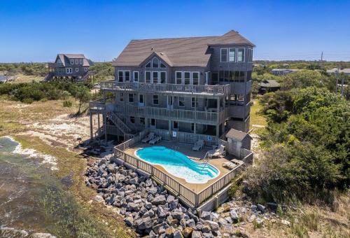 an aerial view of a large house with a swimming pool at 8650 - Mare Vista Retreat in Frisco