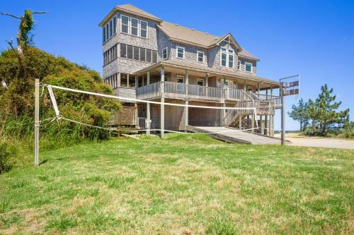 a large house on top of a grass field at 8650 - Mare Vista Retreat in Frisco