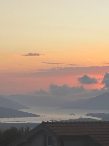 a sunset from the roof of a house at Apartment Brijest-Kotor in Kotor