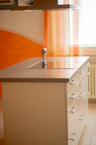 a kitchen with a sink and a counter top at Stube Hotel und Gasthaus in Nordrach