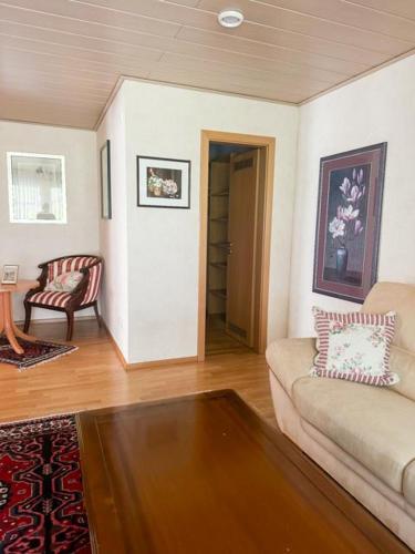 a living room with a couch and a table at Stube Hotel und Gasthaus in Nordrach