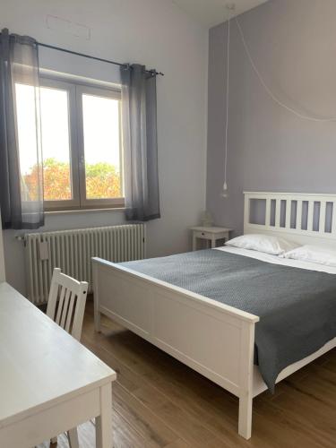 En eller flere senge i et værelse på Vento Barocco - Equitazione e Turismo