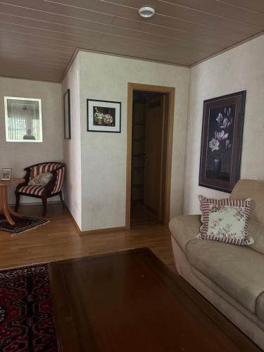 a living room with a couch and a table at Stube Hotel und Gasthaus in Nordrach