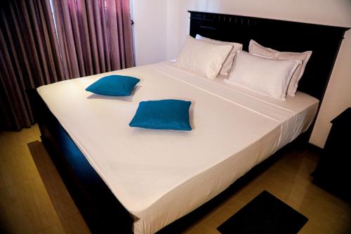 Giường trong phòng chung tại Villana Villa Bentota