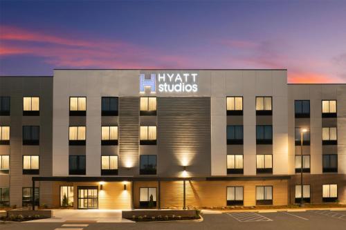 an office building with avent studies sign on it at Hyatt Studios Mobile/Tillmans Corner in Mobile