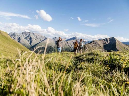 a group of people standing on top of a mountain at Retreat in Samnaun Alps in Samnaun