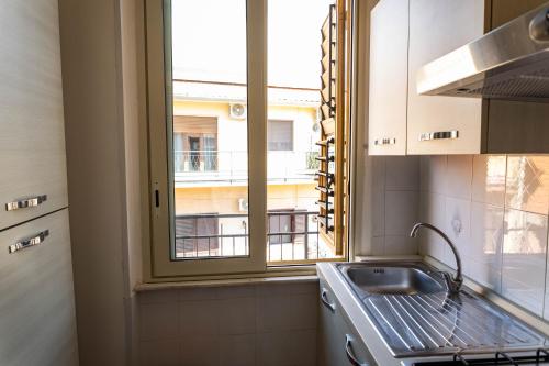 Kuchyň nebo kuchyňský kout v ubytování Etna Visions Apartment