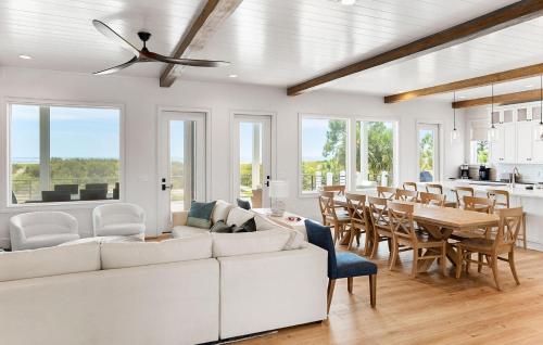 a living room with a white couch and a table at 718 Swordfish Road in Fripp Island