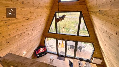 an overhead view of a dining room in a log cabin at Les Atypiques Chalets in Barbey-Séroux