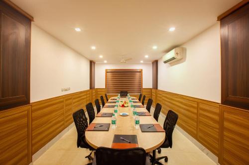 a large conference room with a long table and chairs at Hotel Laals Inn Grand By Jesway Hotels and Resorts in Cochin