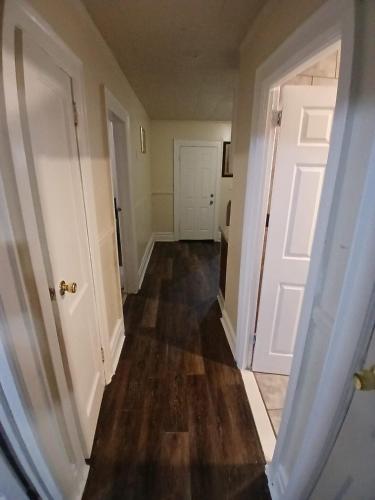 an empty hallway of a house with a door at Z & Z APARTMENt 4 in Newark
