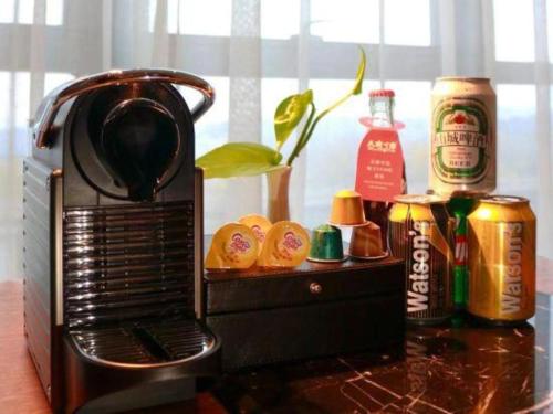 a toaster oven sitting on a counter next to a window at Grand Metropark Hotel Chongqing in Chongqing