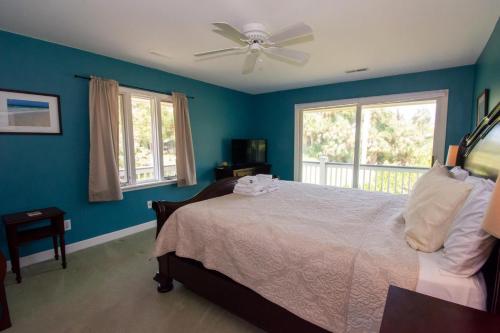a bedroom with a bed and a ceiling fan at 579 Remora Dr in Fripp Island
