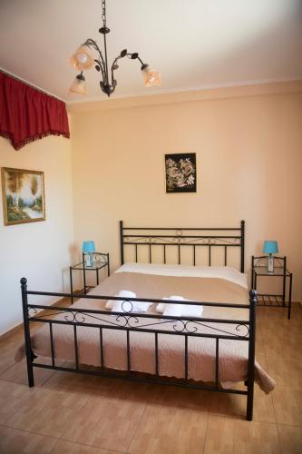 a bedroom with a bed in a room at Irida Suite in Salamís