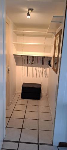 a hallway with a black bag hanging from the ceiling at Studio des cimes in Bussang
