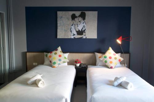Кровать или кровати в номере Chalong Sea Breeze