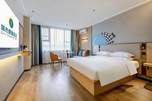 Postel nebo postele na pokoji v ubytování City Comfort Inn Beihai Hepu Bus Terminal