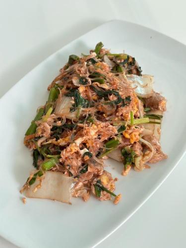 a plate of food on a white plate at Rattana View in Phitsanulok
