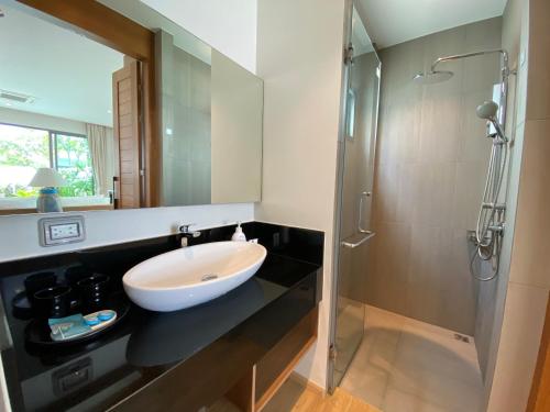 a bathroom with a sink and a shower at Tropical Shambala Grand Villa in Bang Tao Beach