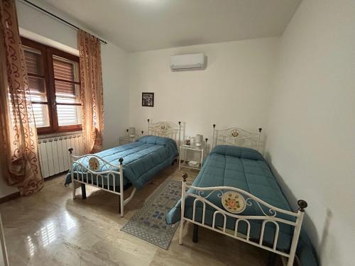 Ένα ή περισσότερα κρεβάτια σε δωμάτιο στο Locanda Su mere b&d