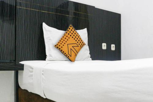 Cama o camas de una habitación en SPOT ON 3605 Clarichie Guest House