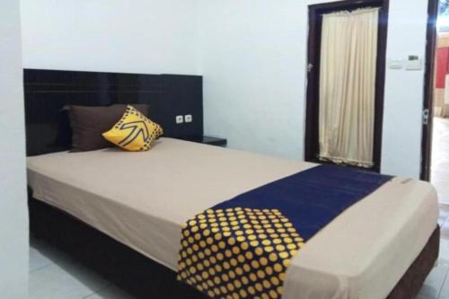 Cama o camas de una habitación en SPOT ON 3605 Clarichie Guest House