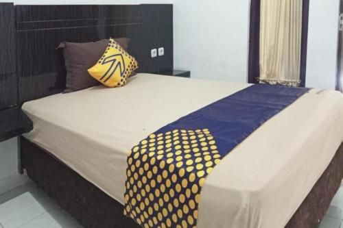 Cama o camas de una habitación en SPOT ON 3605 Clarichie Guest House