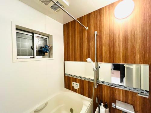 Et badeværelse på Rest one room大阪-阪急梅田駅から電車と徒歩で15分-神崎川駅から徒歩7分-