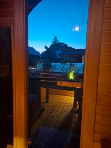 a window view of a table on a porch at Domek Walentinki in Rogacze