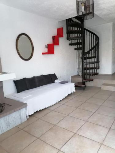a bedroom with a bed with red arrows on the wall at Kapsochora blue in Pefkohori