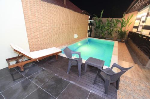 Бассейн в Bukit Suites Villa или поблизости
