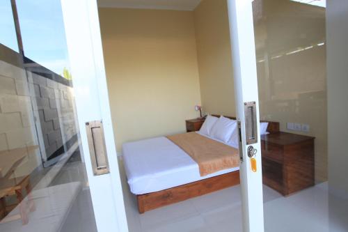 Кровать или кровати в номере Bukit Suites Villa