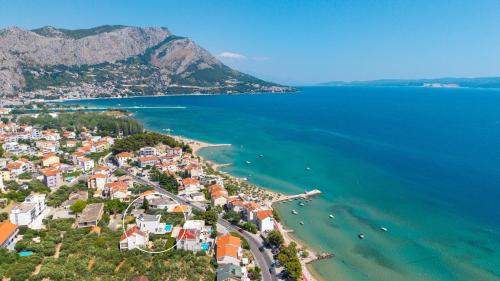 an aerial view of a town on the beach at Luxurious VILLA LAPIS - heated pool, sauna, gym and spa, 120m to sandy beach in Omiš