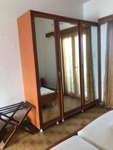 a room with a large glass door with aoirificial at Anthoulis Studios in Kefalos