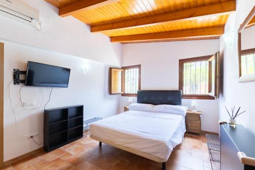 Ένα ή περισσότερα κρεβάτια σε δωμάτιο στο Chalet Barraca d 'Aigües Vives