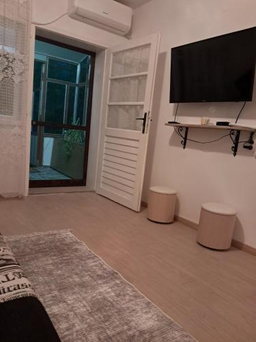 TV a/nebo společenská místnost v ubytování 3M Home
