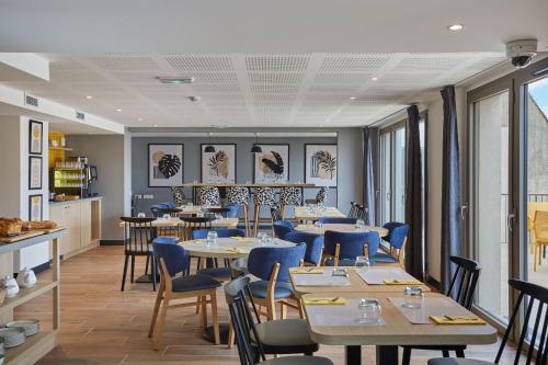 Coin salon dans l'établissement Appart'hôtel Odalys City - Nîmes Arènes - Palais des Congrès