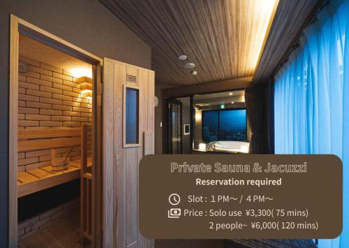 a room with a bathroom with a sink and a mirror at LINNAS Kanazawa in Kanazawa