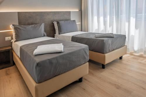Ένα ή περισσότερα κρεβάτια σε δωμάτιο στο Liliya Rooms