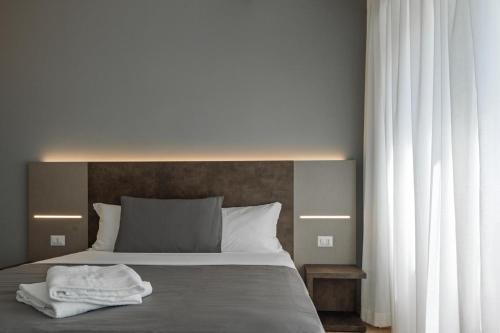 Ένα ή περισσότερα κρεβάτια σε δωμάτιο στο Liliya Rooms