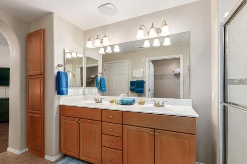 a bathroom with a sink and a large mirror at Mountain View #912 Surprise in Surprise