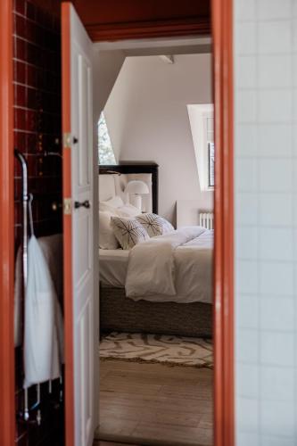 an open door to a bedroom with a bed at HIGHFIELD in Great Driffield