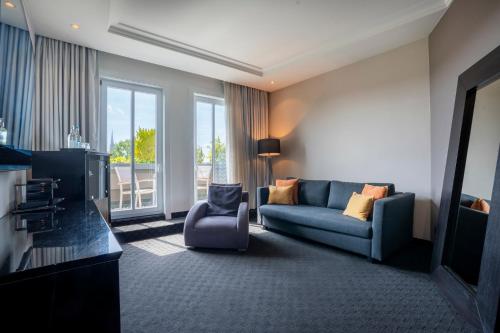 a living room with a couch and a chair at New Berlin in Berlin